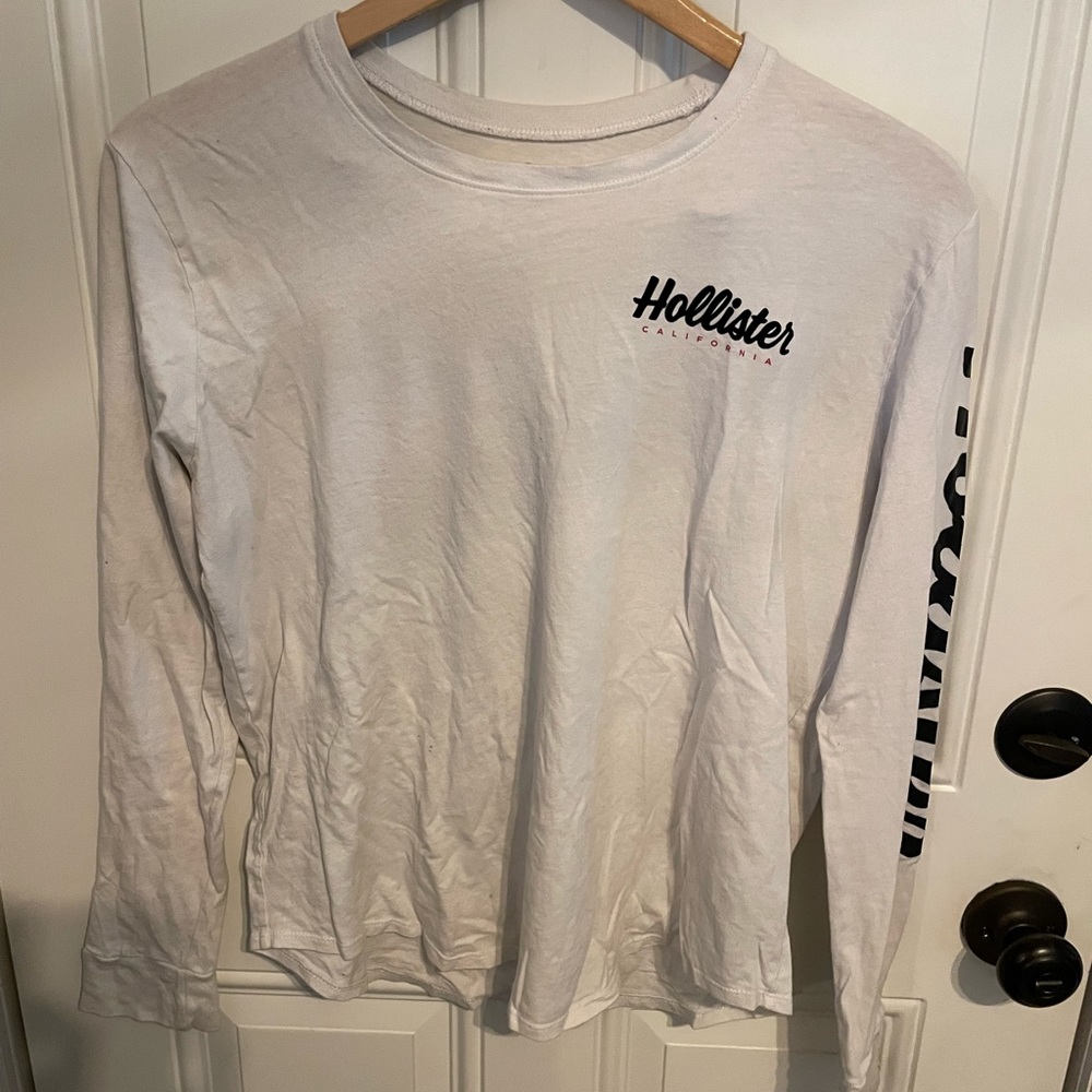 Long sleeve white hollister shirt with hollister brand name on front and back